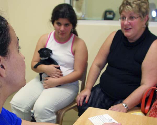 A counselor talks with a puppy s new family. Good Advice Adoption counselors help make shelters good places to find pets.