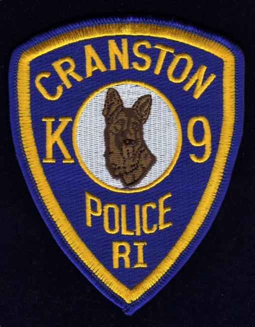 In 2000, after much negotiation, the unit was re-established, and Officer John Lamantia became Cranston s first K-9 officer since 1965. Cranston Police K-9 officer s uniform shoulder patch.