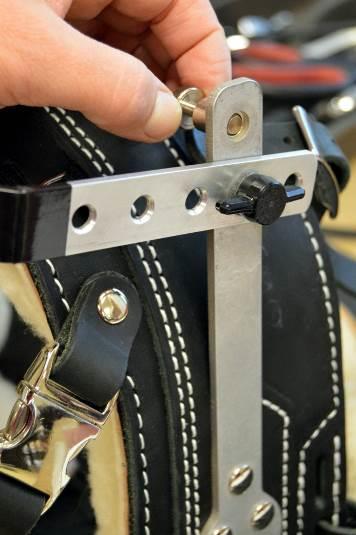 Handle folding mechanism is engaged by pulling two small pegs one on each side of the handlebar. Select one option: o Standard release pegs Standard release pegs are a small metal knob (dime sized).