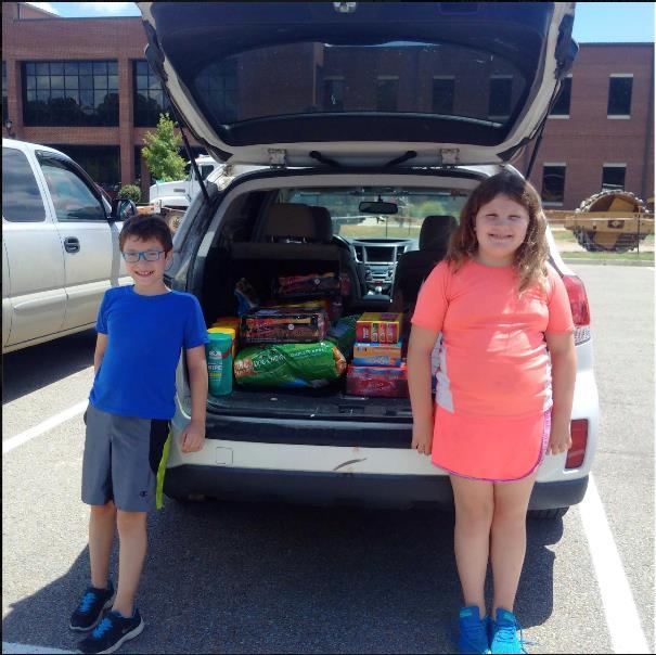 of food, $70 in funds, and supplies for crate cleaning. We are really proud of them and thankful for their awesome friends and the families who supported their food and supply drive for Paws Rescue!