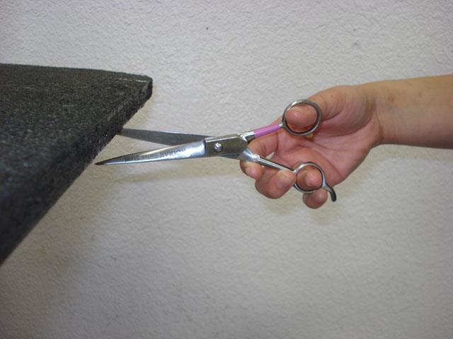 Put scissors under a table and push up as you open and close the scissors.