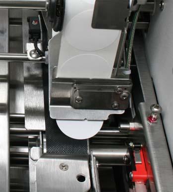 OPERATING THE Tabber 2. Lift the tab drive Pressure Roller Release Latch on Head 2, to release the pressure between the tab stock and the Tab Drive Roller. 3.
