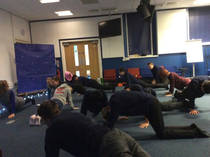 The photos show everyone participating in the relaxation stretches towards the end of the session.