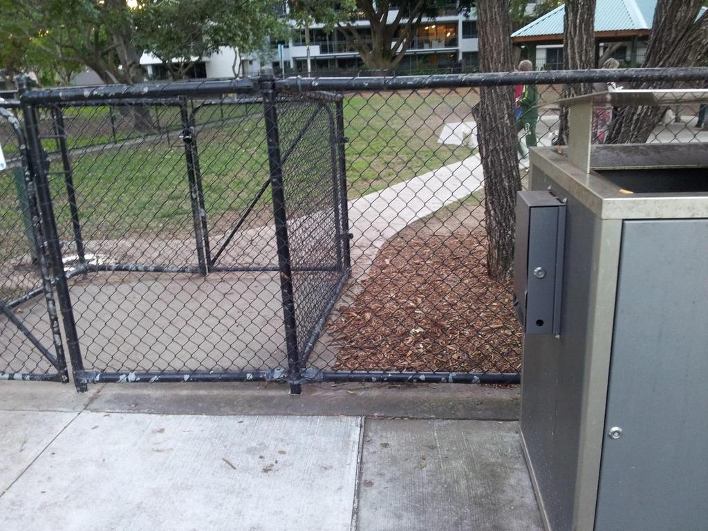 Overview of a Dog Park air lock double gate entry, Doggy Do bag dispenser station & rubbish bin structure.